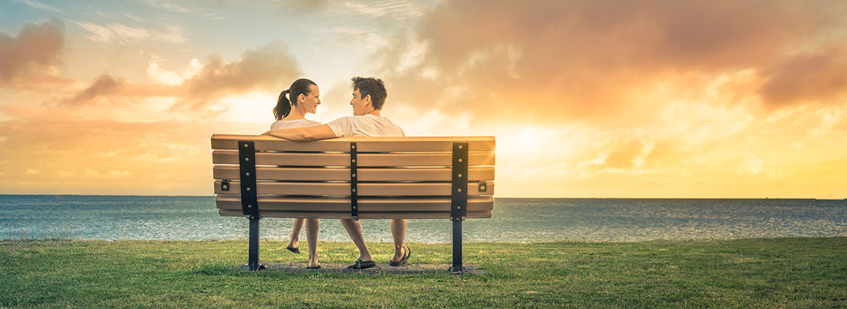 couple sitting at a bench